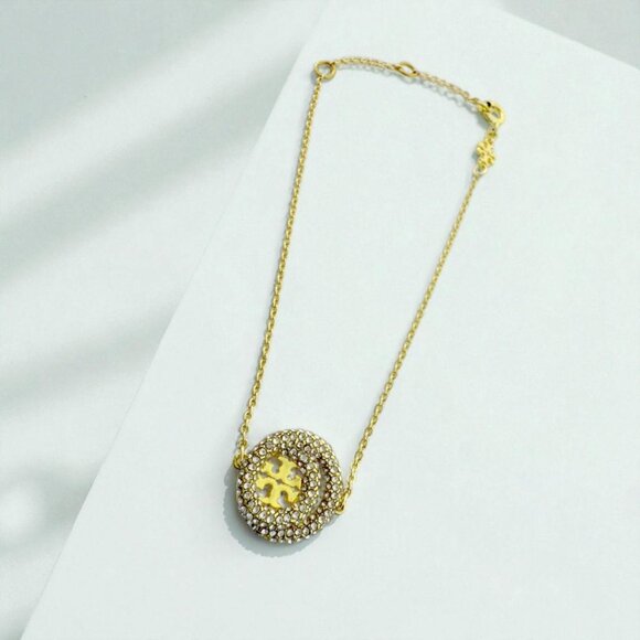 Tory Burch Miller crystal-embellished bracelet in Gold. - Picture 1 of 3